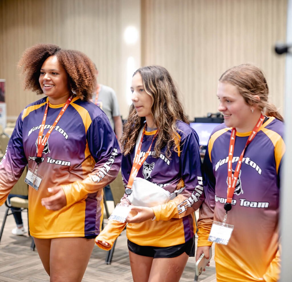 drone racing team receiving instructions