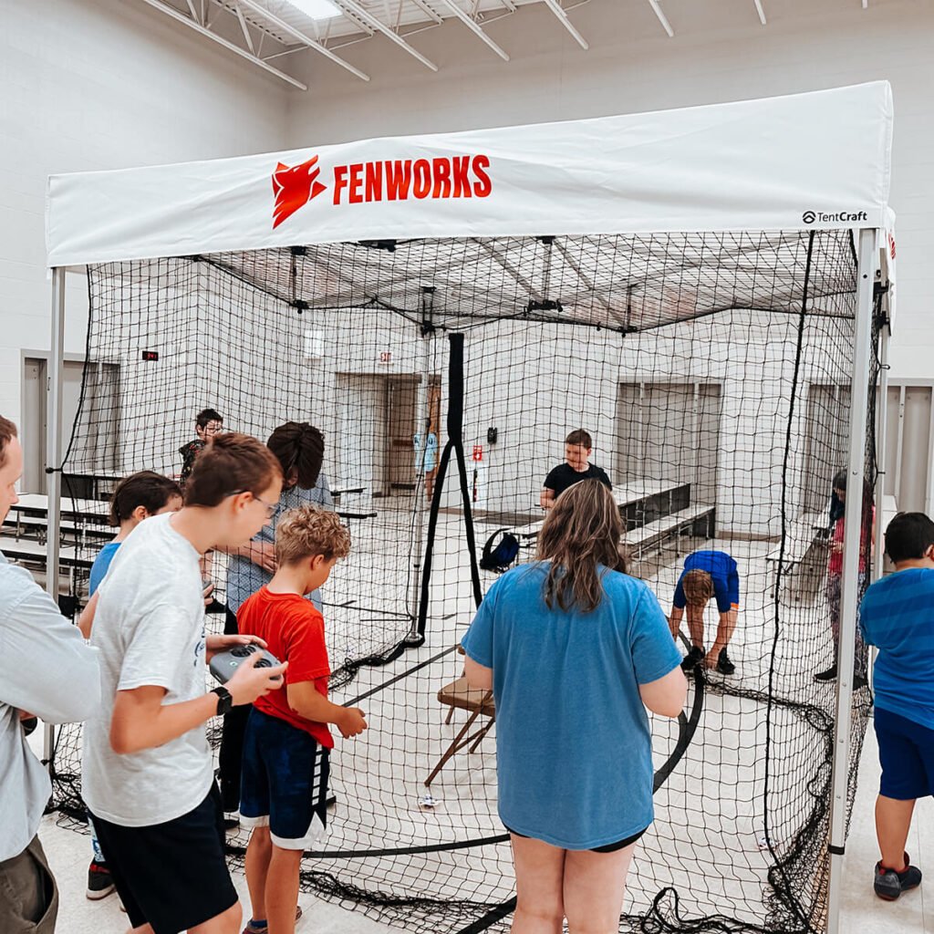Students trying out racing drones
