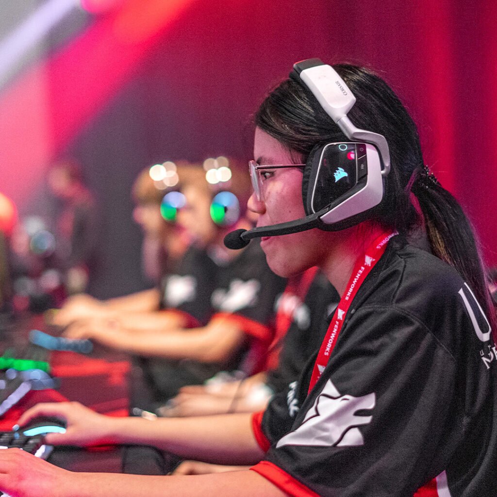 Young woman participating in the esports tournament