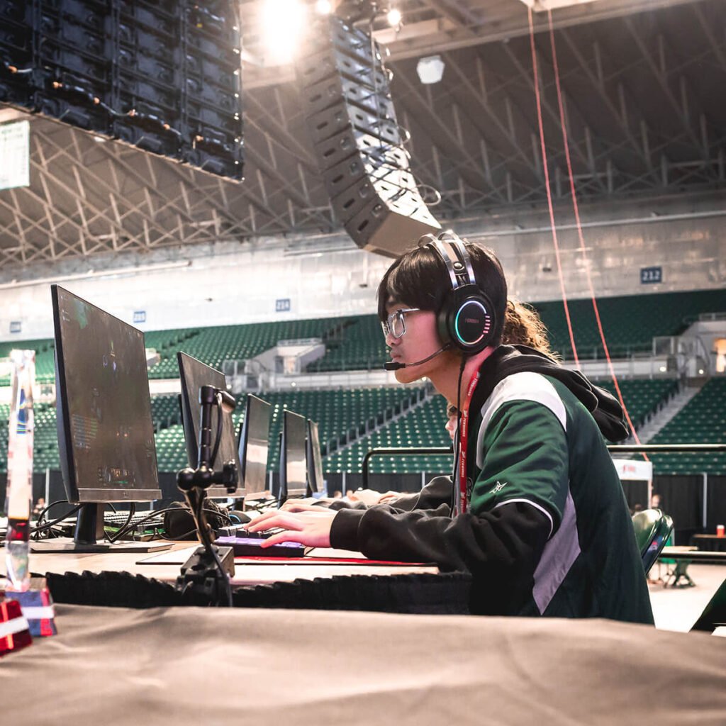Esports tournament participant playing a game